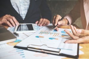 Business,Concept.,Business,Team,With,Documents,Having,Discussion,In,Office