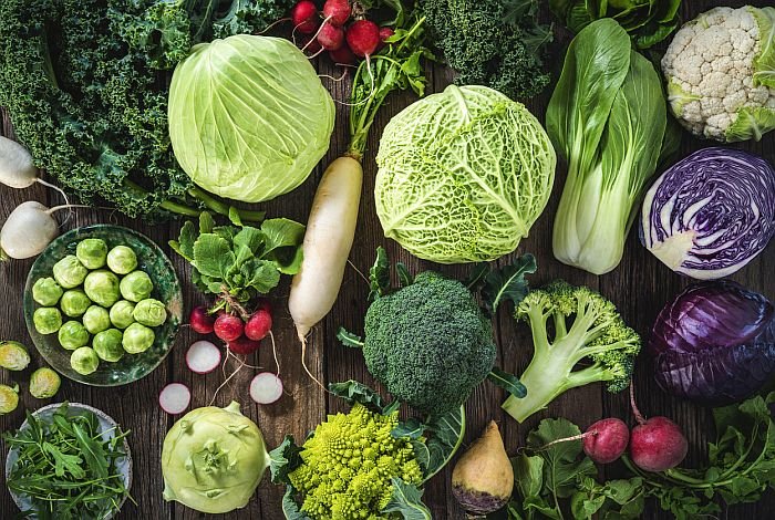 Crucifers vegetables assortment as cabbage, broccoli, cabbage, turnip, kale, romanesco, radish, arugula