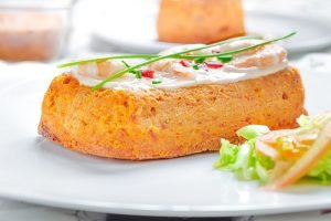 Delicious Fish cake. Hake cake with tomato, shrimps, chive and salad cream.