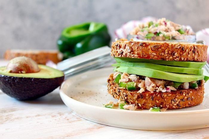 Sandwich with tuna, avocado and vegetables for snack or lunch.