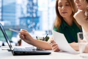 Employers using laptop device to find qualified candidates through job postings